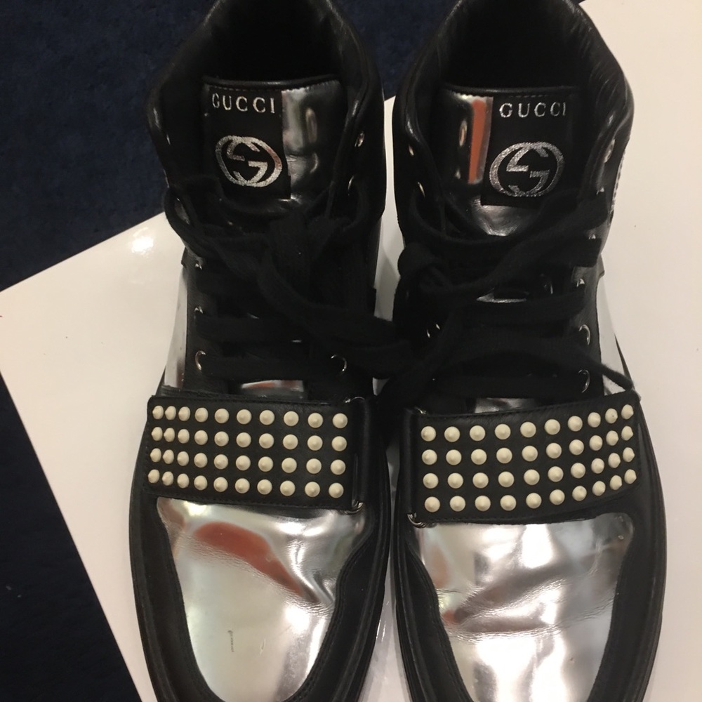 Men Gucci high-top sneakers.